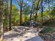 Spacious backyard deck with seating area, fire pit, and covered pond at 495 Claire Ne Dr, Atlanta, GA 30307