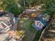 Aerial view of backyard with a detached shed, patio, and lush greenery at 495 Claire Ne Dr, Atlanta, GA 30307