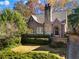 Charming brick home with stone chimney and lush landscaping at 495 Claire Ne Dr, Atlanta, GA 30307