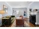 Living room with fireplace, hardwood floors, stylish furniture and natural light at 495 Claire Ne Dr, Atlanta, GA 30307