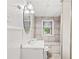 Small bathroom with a built-in shower seat at 3530 Fairlane Nw Dr, Atlanta, GA 30331