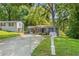 Ranch style home with a gray exterior, blue shutters, and a carport at 3530 Fairlane Nw Dr, Atlanta, GA 30331