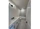 Modern bathroom with white vanity, grey tile, and bathtub at 500 Chiswick Cir, Alpharetta, GA 30009