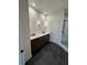 Bathroom boasts double vanity, dark cabinets, and a large shower at 500 Chiswick Cir, Alpharetta, GA 30009