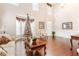 Bright living room with hardwood floors and bay window at 1214 Glen Devon Pl, Powder Springs, GA 30127