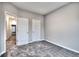 Bedroom with carpet, and access to hallway and closets at 335 Meloody Ne Ln, Cartersville, GA 30121