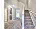 Open staircase with gray carpet runner and neutral wall colors at 335 Melody Ne Ln, Cartersville, GA 30121