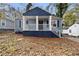 Newly renovated home with blue siding, white trim, and a covered porch at 1417 Graymont Sw Dr, Atlanta, GA 30310