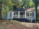 Blue house with white columns and a spacious front porch at 1417 Graymont Sw Dr, Atlanta, GA 30310
