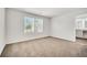 Spacious bedroom with neutral carpeting and large windows at 1633 Fuma Leaf Way, Mcdonough, GA 30253