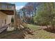 Backyard with trees, deck, and stairs at 185 Witheridge Dr, Johns Creek, GA 30097