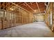 Unfinished basement with framed walls and concrete flooring at 185 Witheridge Dr, Johns Creek, GA 30097