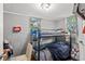 Small bedroom with a bunk bed and hardwood floors at 1324 Almont Sw Dr, Atlanta, GA 30310