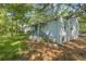 Side view of a light blue house with green porch at 1324 Almont Sw Dr, Atlanta, GA 30310