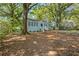 Cute blue house with a large yard and mature trees at 1324 Almont Sw Dr, Atlanta, GA 30310