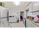 Kitchen with gray cabinets, tile backsplash, and stainless steel appliances at 1324 Almont Sw Dr, Atlanta, GA 30310