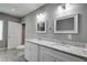 Updated bathroom with double vanity, granite countertops, and gray walls at 1544 Childress Sw Dr, Atlanta, GA 30311