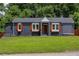 Charming ranch home with gray exterior, wood accents, and manicured lawn at 1544 Childress Sw Dr, Atlanta, GA 30311