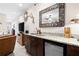 Basement wet bar with granite countertops at 304 Woodstock Seven Dr, Woodstock, GA 30188