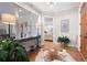 Bright entryway with hardwood floors, console table, and cowhide rug at 304 Woodstock Seven Dr, Woodstock, GA 30188