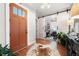 Entryway with hardwood floors, barn door to office, and cowhide rug at 304 Woodstock Seven Dr, Woodstock, GA 30188