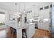 Modern kitchen with large island, stainless steel appliances, and granite counters at 304 Woodstock Seven Dr, Woodstock, GA 30188