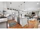 Modern kitchen with large island, stainless steel appliances, and granite counters at 304 Woodstock Seven Dr, Woodstock, GA 30188