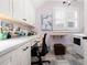 Laundry room with built-in workspace and cabinets, creating a functional and stylish area at 304 Woodstock Seven Dr, Woodstock, GA 30188