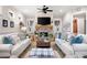 Bright living room featuring a stone fireplace and two sofas at 304 Woodstock Seven Dr, Woodstock, GA 30188