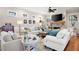 Spacious living room with stone fireplace, hardwood floors, and comfortable seating at 304 Woodstock Seven Dr, Woodstock, GA 30188