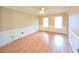 Spacious dining room with chair rail, wood floors, and ample natural light at 4106 Duesenburg Dr, Tucker, GA 30084