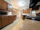 Kitchen with ample counter space, black appliances, and wood cabinets at 4106 Duesenburg Dr, Tucker, GA 30084