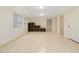 Spacious finished basement with tile flooring and built-in shelving at 4830 Chesterfield Ct, Suwanee, GA 30024