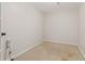 Small, carpeted basement room with a door at 4830 Chesterfield Ct, Suwanee, GA 30024