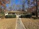 Ranch home with front porch and landscaped yard at 5090 Great Meadows Rd, Lithonia, GA 30038