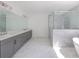 Modern bathroom with dual vanity, walk-in shower, and freestanding tub at 816 Hillwood Dr, Marietta, GA 30068