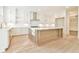 Bright, spacious kitchen with white cabinets, large island, and stainless steel appliances at 816 Hillwood Dr, Marietta, GA 30068