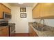 Modern kitchen with stainless steel appliances and granite countertops at 1150 Collier Nw Rd # 4B, Atlanta, GA 30318