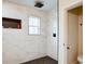 Modern bathroom with marble shower, rainfall shower head, and a built-in niche at 1930 Pinedale Nw Dr, Atlanta, GA 30314