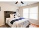 Bedroom with rustic wood headboard, ceiling fan and hardwood floors at 1930 Pinedale Nw Dr, Atlanta, GA 30314