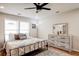 Spacious bedroom with king-size bed, dresser, and ceiling fan at 1930 Pinedale Nw Dr, Atlanta, GA 30314