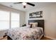 Spacious bedroom with hardwood floors, large windows, and a ceiling fan at 1930 Pinedale Nw Dr, Atlanta, GA 30314