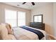 Bedroom with dresser, ceiling fan, and hardwood floors at 1930 Pinedale Nw Dr, Atlanta, GA 30314