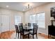 Bright dining room with hardwood floors, round table, and six chairs at 1930 Pinedale Nw Dr, Atlanta, GA 30314