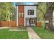 Modern two-story house with wood and white exterior, landscaped lawn, and fenced yard at 1930 Pinedale Nw Dr, Atlanta, GA 30314