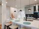 Modern kitchen with gray cabinets, white countertops, and black pendant lighting at 1930 Pinedale Nw Dr, Atlanta, GA 30314