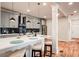 Modern kitchen with gray cabinets, white quartz countertops, and breakfast bar at 1930 Pinedale Nw Dr, Atlanta, GA 30314