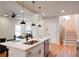 Modern kitchen with island, stainless steel appliances, and white cabinetry at 1930 Pinedale Nw Dr, Atlanta, GA 30314