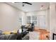 Open concept living room with hardwood floors, gray sofas, and a view of the entryway at 1930 Pinedale Nw Dr, Atlanta, GA 30314