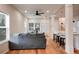 Open concept living area with hardwood floors, gray sofa, and kitchen island view at 1930 Pinedale Nw Dr, Atlanta, GA 30314